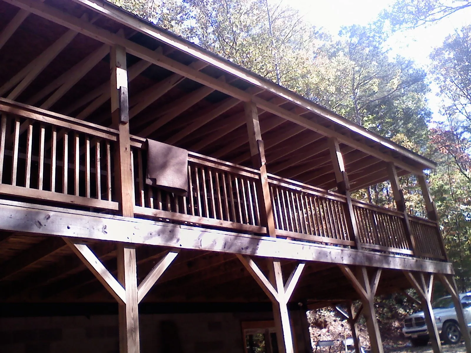 Timber framing under a new elevated porch and deck — Roof Leak Repair in Manhattan by Roofing Brothers